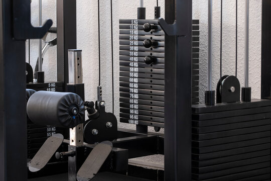 Gym machines with weight stacks in perspective