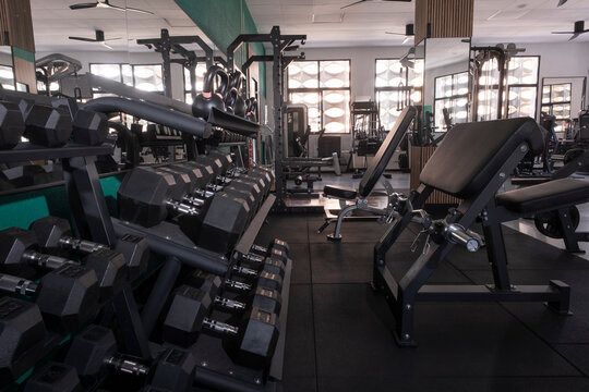 Gym interior with machines and natural light