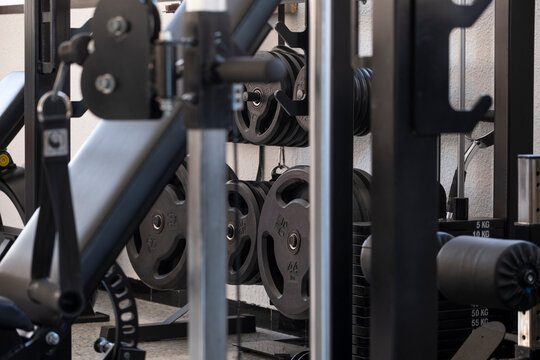 Gym machines with weight stacks in perspective