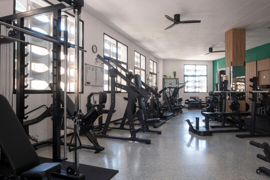 Gym interior with machines and natural light