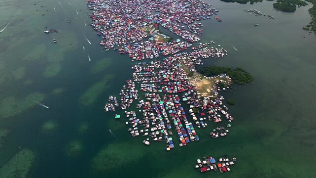 Traditional Bajau Laut Village, Sea Gypsy people in Semporna, Borneo, Malaysia. Stilt Houses Above Sea Waters