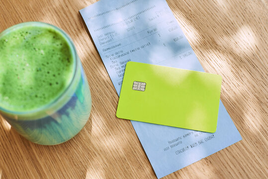 Payment and receipt at the cafe with green matcha