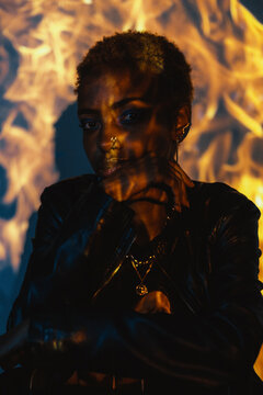 Woman Posing in a Colourful Lighting Setup Indoors