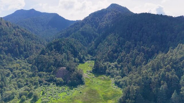 Elevated view of the Zempoala Lagoons surrounded by forests and mountains