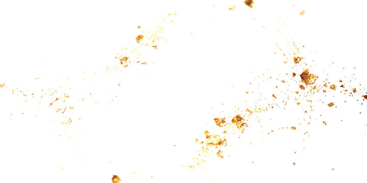Shiny gold leaf flakes floating in the air as a decorative element