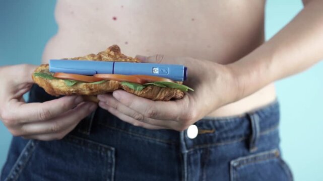 woman dancing holding croissant with weight loss injection pen semaglutide glp-1 medication with copy space for banner design clinical lifestyle concept of healthcare pharmacy obesity treatment medici