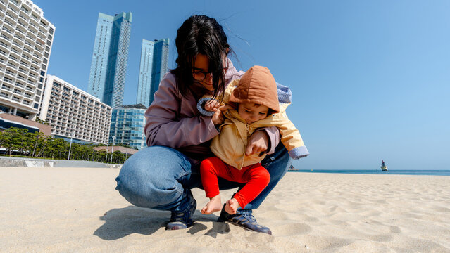 Mother and child on Haeundae Beach in Busan, South Korea