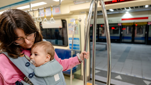 Mother with baby on Taipei Metro train