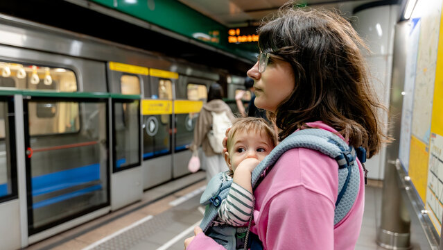 Mother and baby waiting at Taipei Metro station