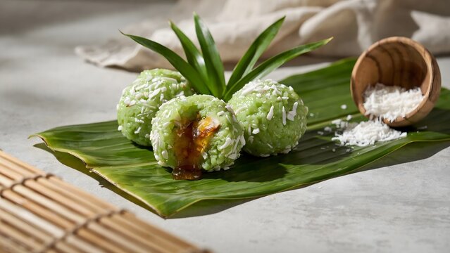 Ondeh ondeh traditional southeast asian sweet dumplings with coconut and palm sugar