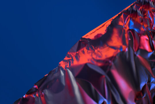 Abstract metallic surface with dark blue background