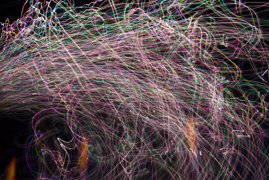 Fireworks and lights creating vibrant patterns at night