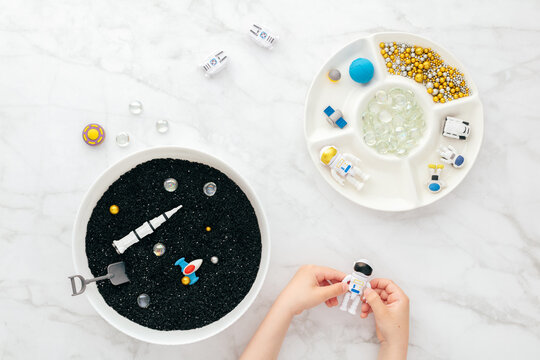 Montessori sensory bin with space theme tactile STEM play
