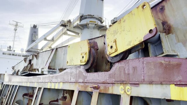 closing ship cargo hold foldable covers. big steel hatch covers came down in position.