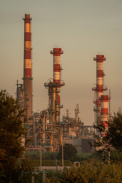 Industrial refinery stacks at sunset near Porto, Portugal