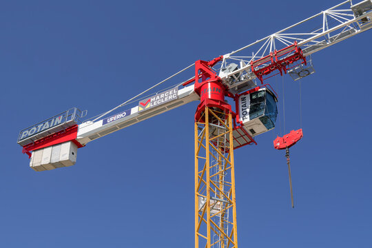 Nancy, France - June 20th 2026 : View on a flat-top tower crane Potain MDT 219 J10 on a construction site for the construction of a building.