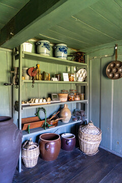 Antique pantry with pottery and baskets on Langene&szlig; island