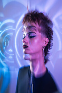 Cyberpunk young woman portrait with neon hologram glitch