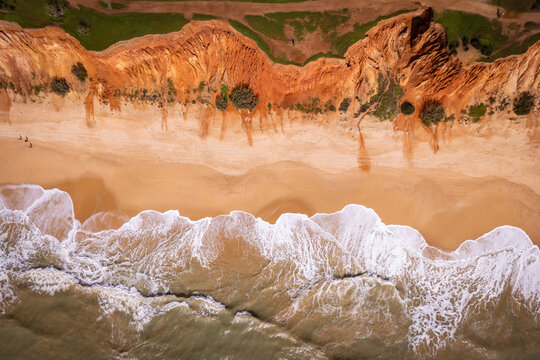 Praia da Falesia Aerial Drone Waves Foam Sandy Beach Red Cliffs Algarve Portugal Abstract Nadir