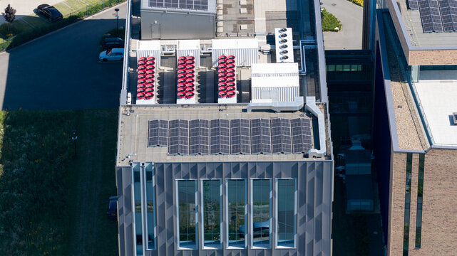 Aerial view of Interconnect Services BV data center featuring rooftop solar panels and industrial HVAC cooling units in 's-Hertogenbosch, Noord-Brabant, Netherlands.