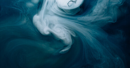 Fototapeta premium Blur ink flow. Smoke swirl. White spiral vortex curl stream on blue black background. Night color fantasy blow defocused abstract cloud.