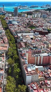 Urban crowd and street atmosphere on Barcelona La Rambla showing dynamic city life and tourism.