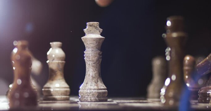 Hand Moving Chess Piece in Slow Motion Close Up