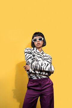 Latin young woman in zebra blouse and white sunglasses