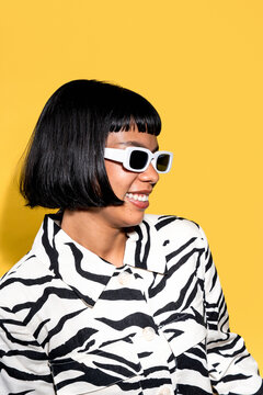 Young latin woman in zebra shirt and white sunglasses