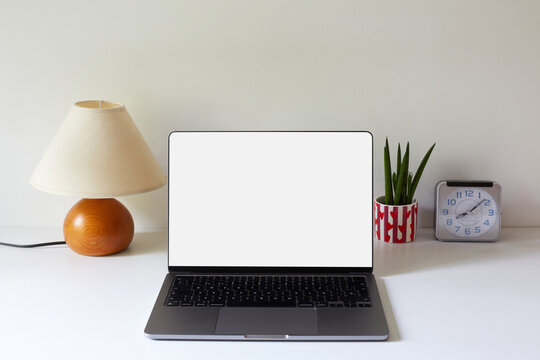 Modern workspace with laptop and home office decor