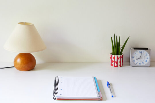 Minimalist desk with stationery and decor items