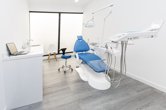 Modern dental clinic interior with empty chair and equipment
