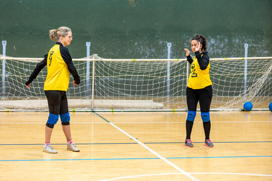 Goalball players on the court showcasing adaptive sport