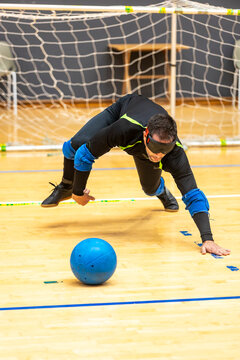Dynamic action in a goalball match showcasing skill