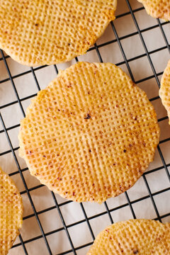 Dutch waffles cooling on wire rack, homemade dessert closeup