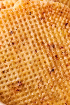 Close-up of Dutch waffle texture, golden baked dessert