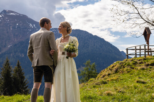 Romantic alpine wedding couple in Austria mountain meadow