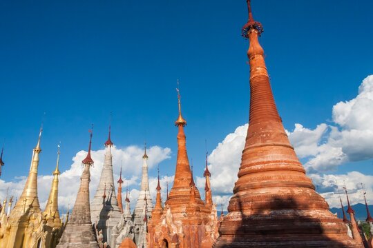 Indein pagoda complex in Myanmar under blue sky