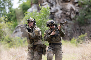 Fototapeta premium Military participate in a patrol in forrest terrain