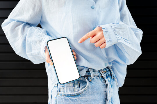 Gen Z holding smartphone with blank screen for app mockup