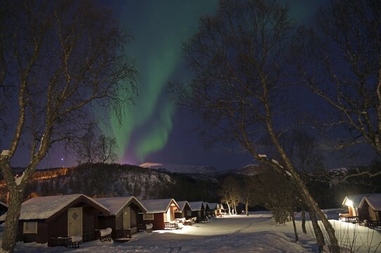 Small cabins and northern lights, winter landscape, camping site, Sortland, Andenes, Norway