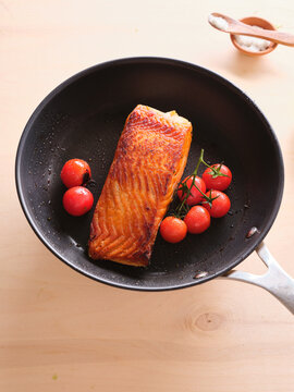 Cooking process of pan-seared salmon filet with cherry tomatoes