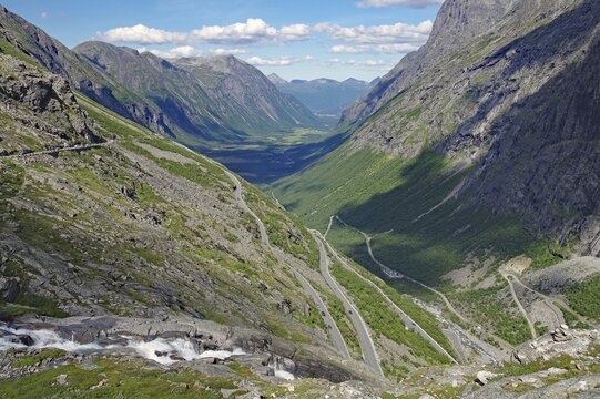 Mountain pass in Zig-Zag serpentines, barren mountains, wild stream, narrow valley, Trollstigen, Way of the Trolls, Andalsnes, Norway
