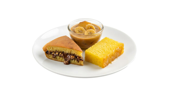 Pencuci Mulut, an authentic Indonesian traditional dessert platter featuring sweet martabak pancake and golden honeycomb bika ambon cake on a plate isolated on a white background