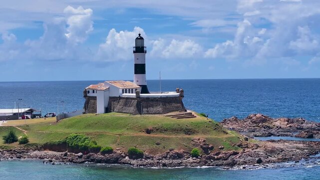 Barra Lighthouse In Salvador Bahia Brazil. Lighthouse Standing Tall On Beach With Ocean Waves Crashing. Downtown Cityscape. District Skyline. Salvador Bahia.