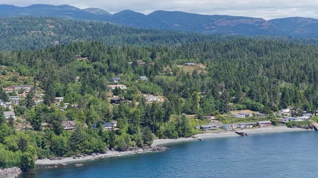 Scenic Vancouver Island Coastline: Houses Nestled Among Lush Forests and Oceanfront Views in British Columbia, Canada