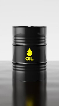 Black metal oil barrel falling into a pond of crude oil with a dramatic liquid splash. Vertical video.