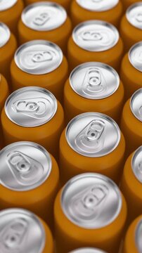 Realistic camera tracking over aluminum beverage cans in gold for beverage packaging and drink industry presentation. Vertical video.