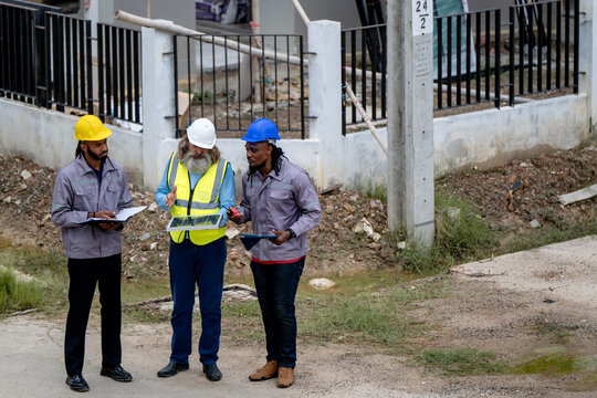 Engineers discussed preparation for installing small solar panels in residential village construction areas for sustainable energy projects and improving the landscape within the village project.