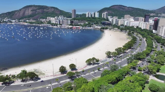 Botafogo Beach In Rio De Janeiro Brazil. Turquoise Ocean Waves Gently Crashing On Tropical Beach. District Skyline. Cities Of The World Landscape. Rio de Janeiro Brazil.